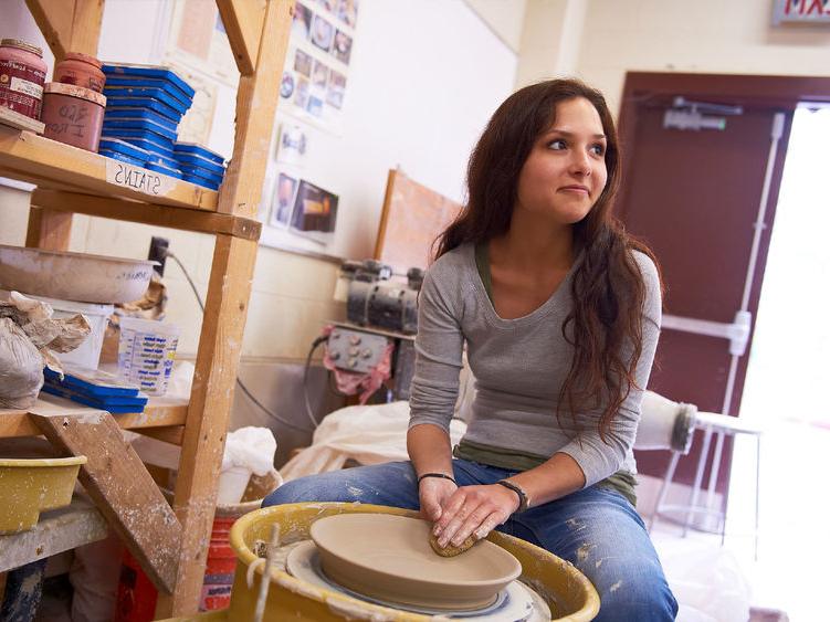 Woman making pottery